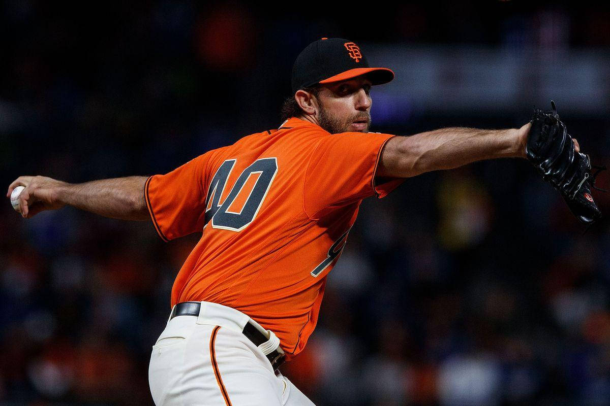 Madison Bumgarner In Orange Jersey Background