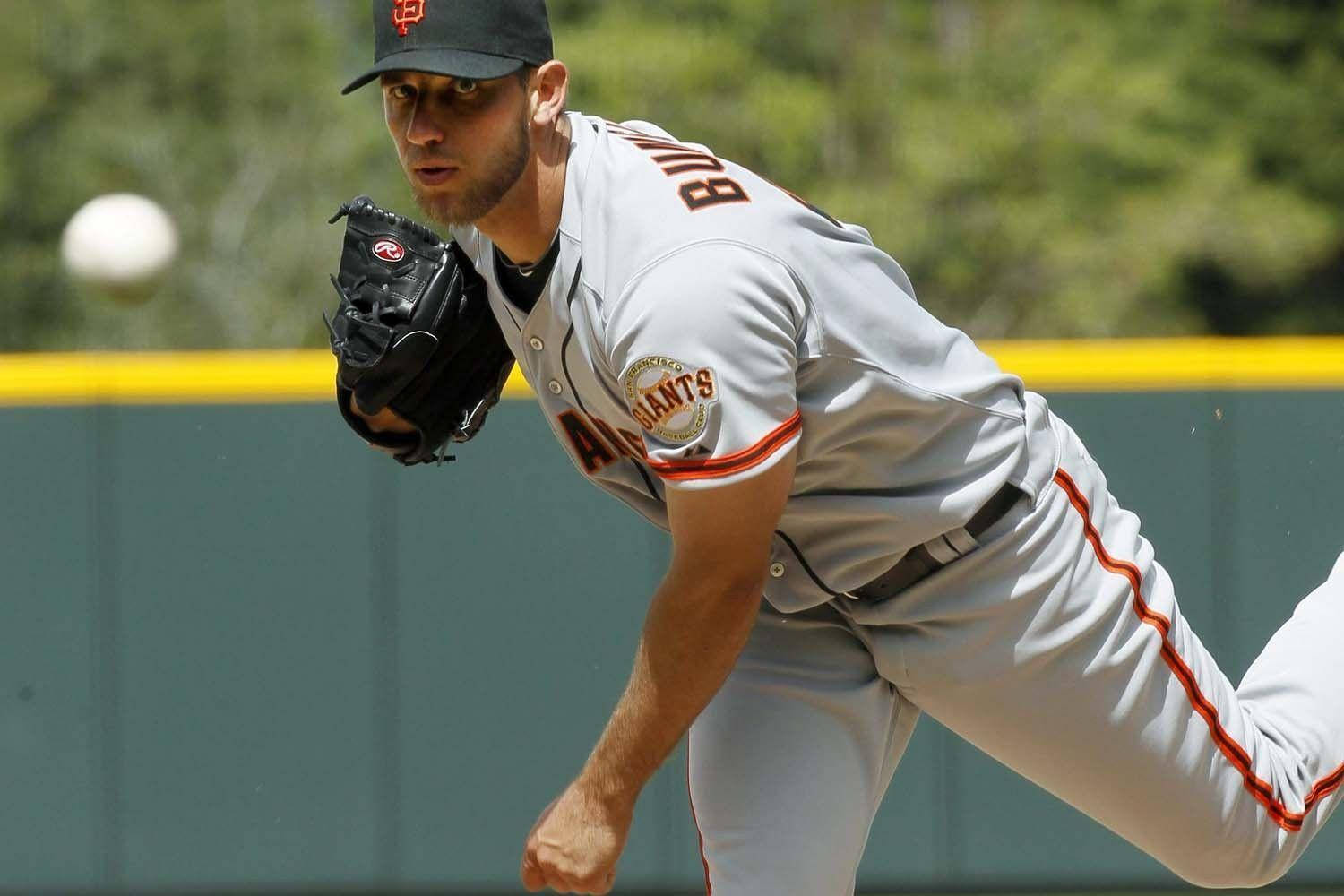 Madison Bumgarner With Baseball Mitt Background