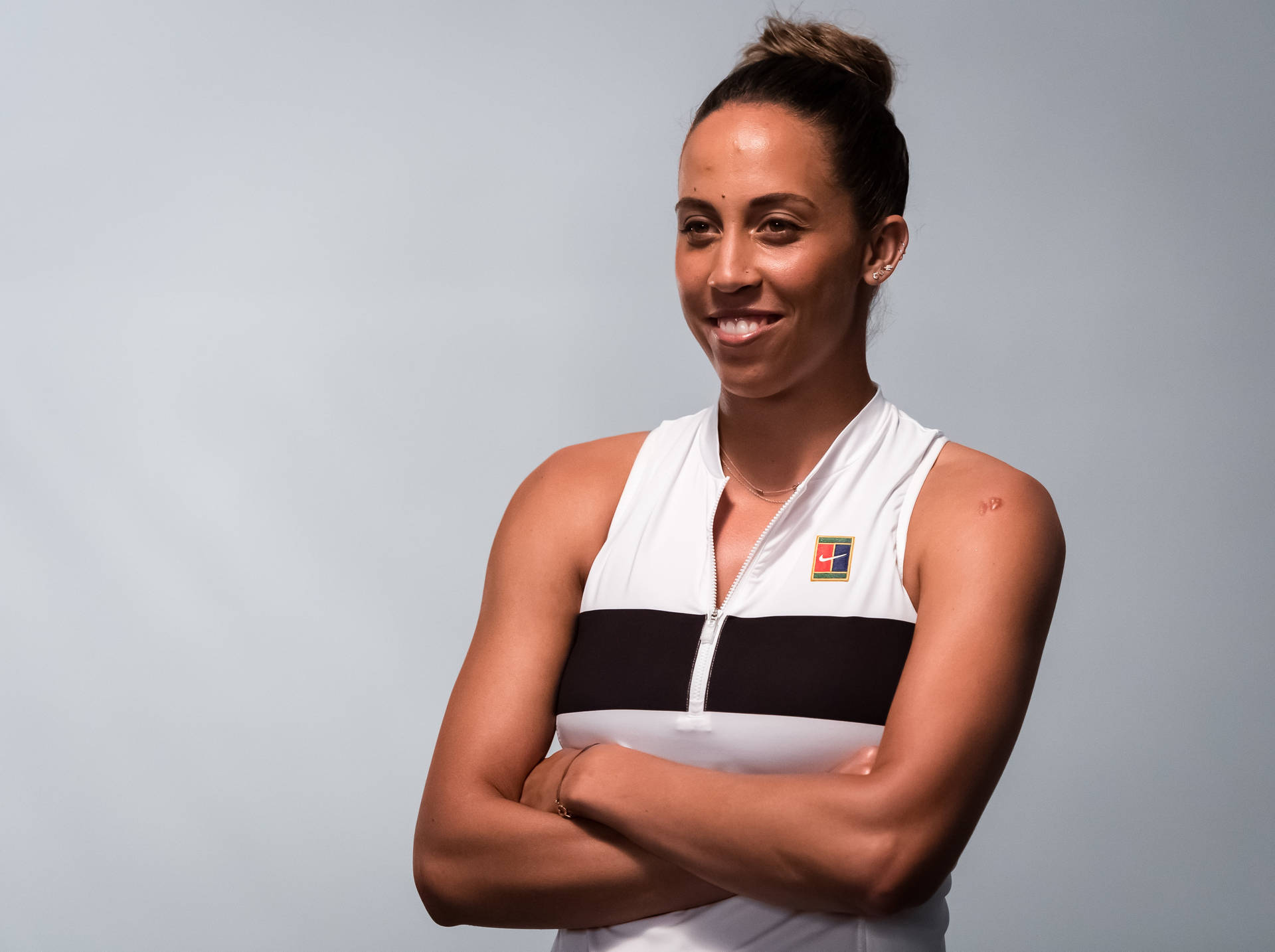 Madison Keys Arms Crossed Background