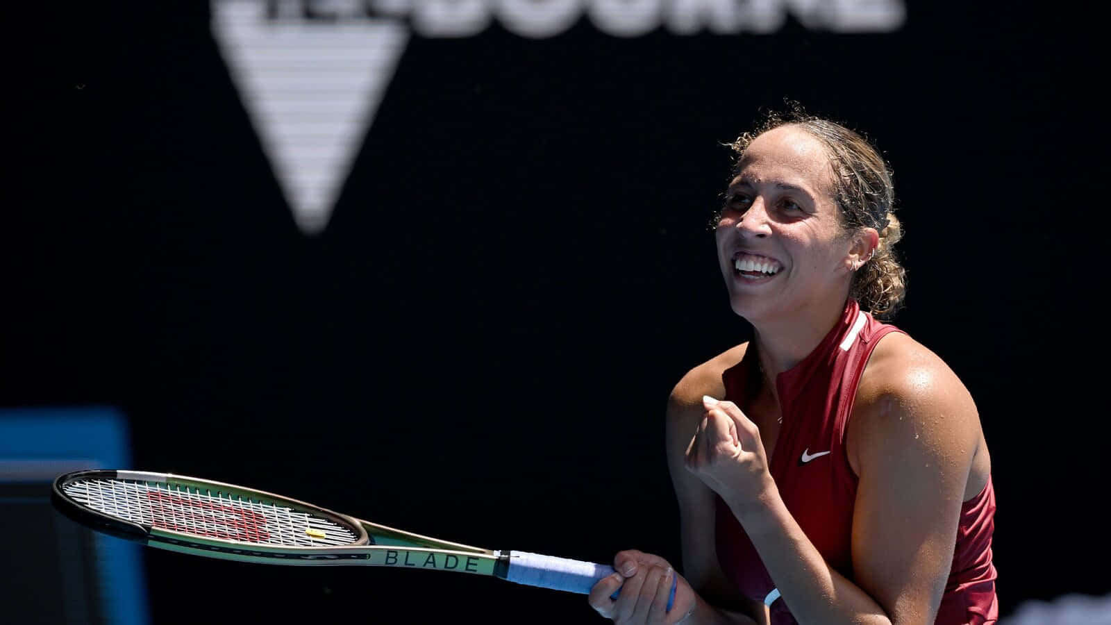 Madison Keys Smiling Happily Background