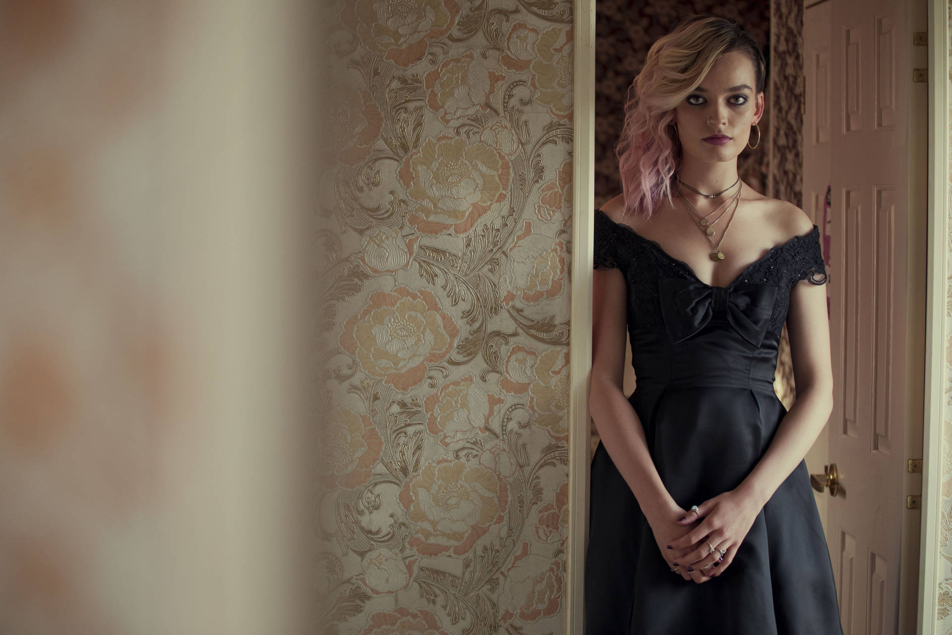 Maeve Wiley In Black Gown Background