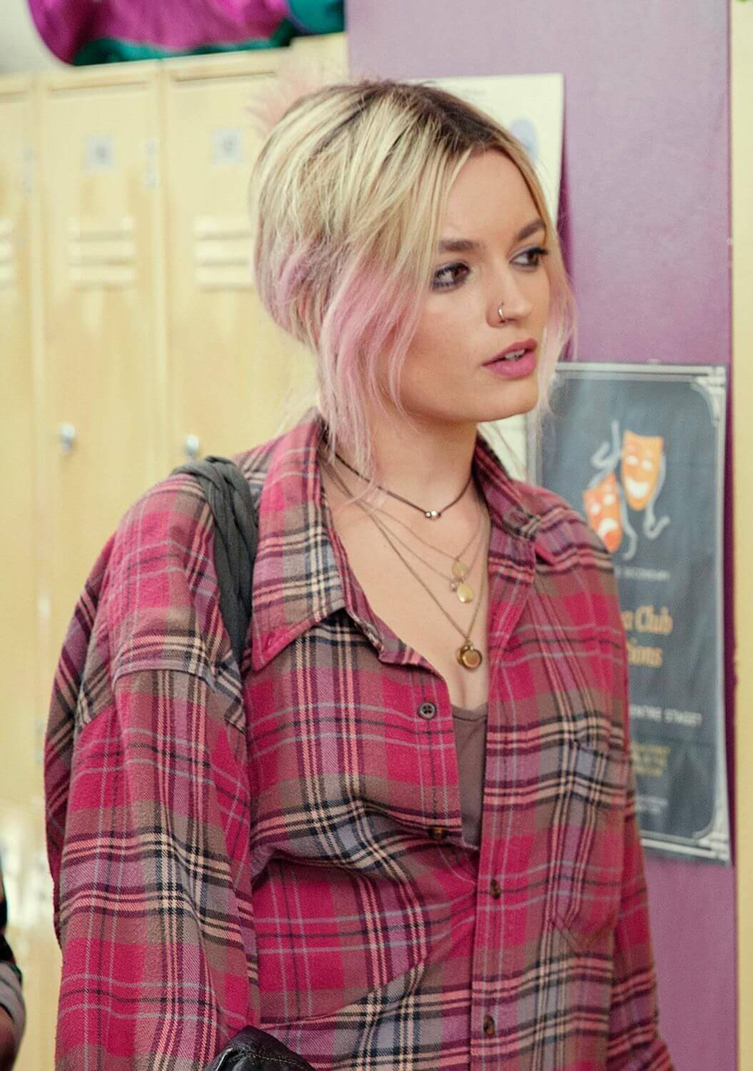 Maeve Wiley In Pink Shirt Background