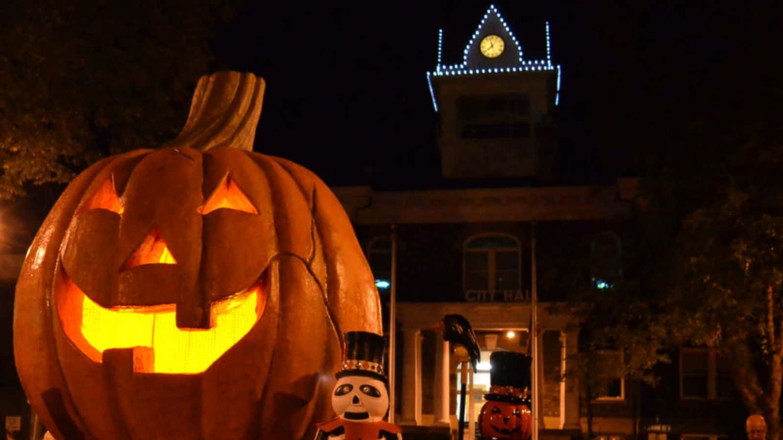 Magical Halloweentown Enchanting The Night With Whimsical Lights And Spectacular Deco Background