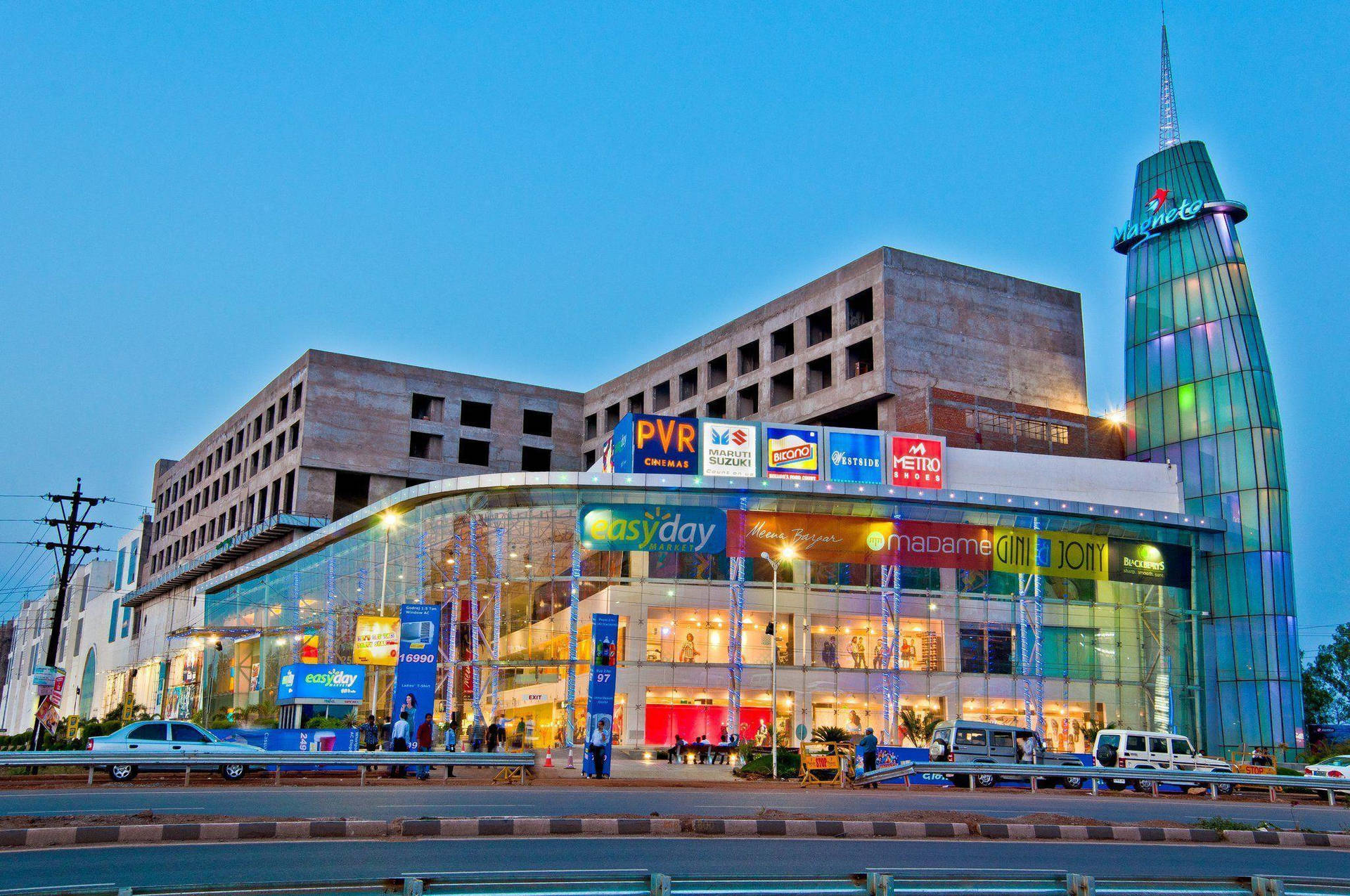 Magneto Mall In India Engulfed In Night's Splendor Background