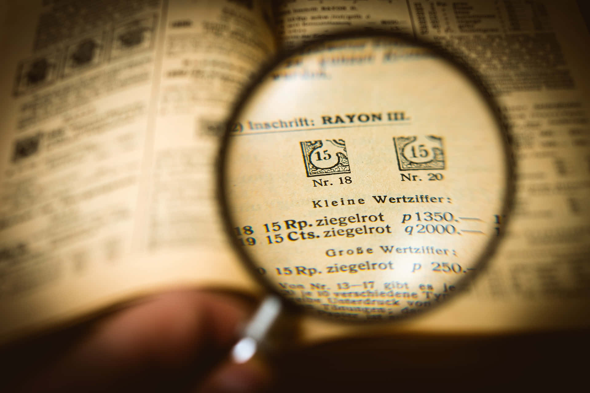 Magnifying Glass On A Textbook Background