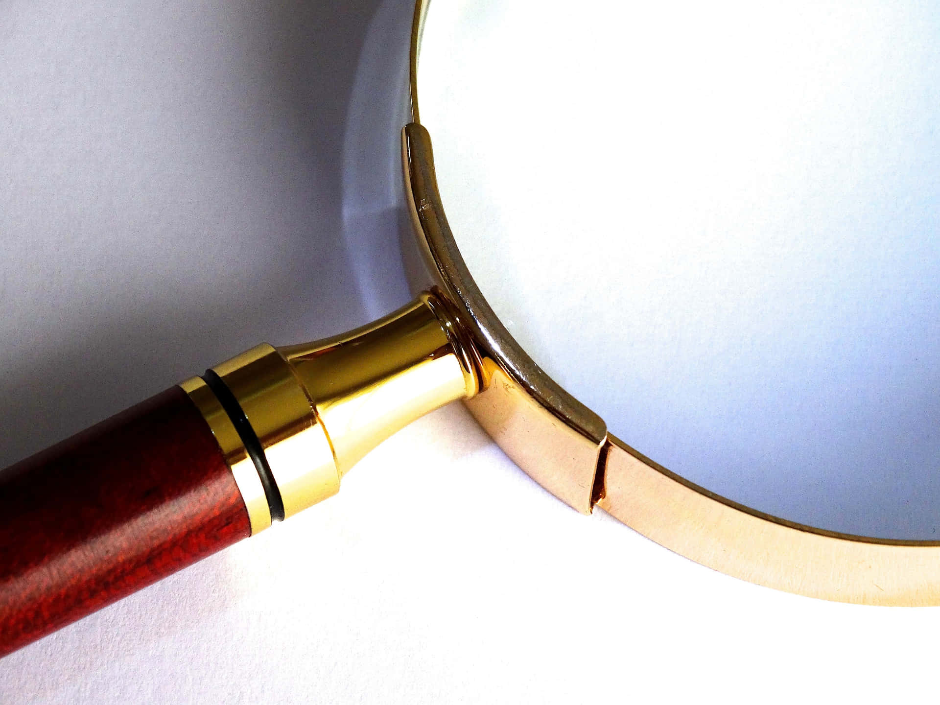 Magnifying Glass Quality Gold Metal Frame Background