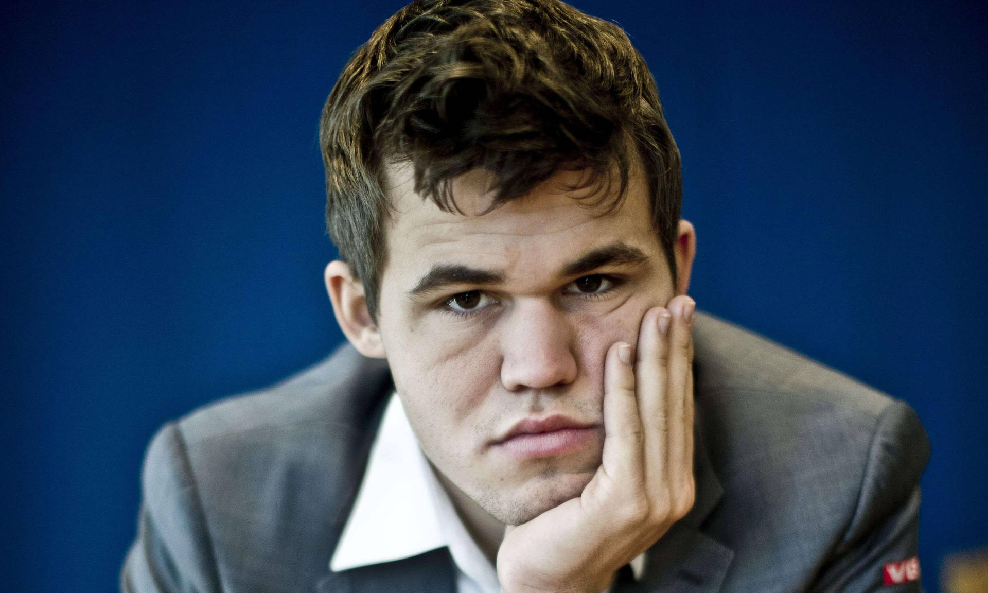 Magnus Carlsen In Deep Thought Background