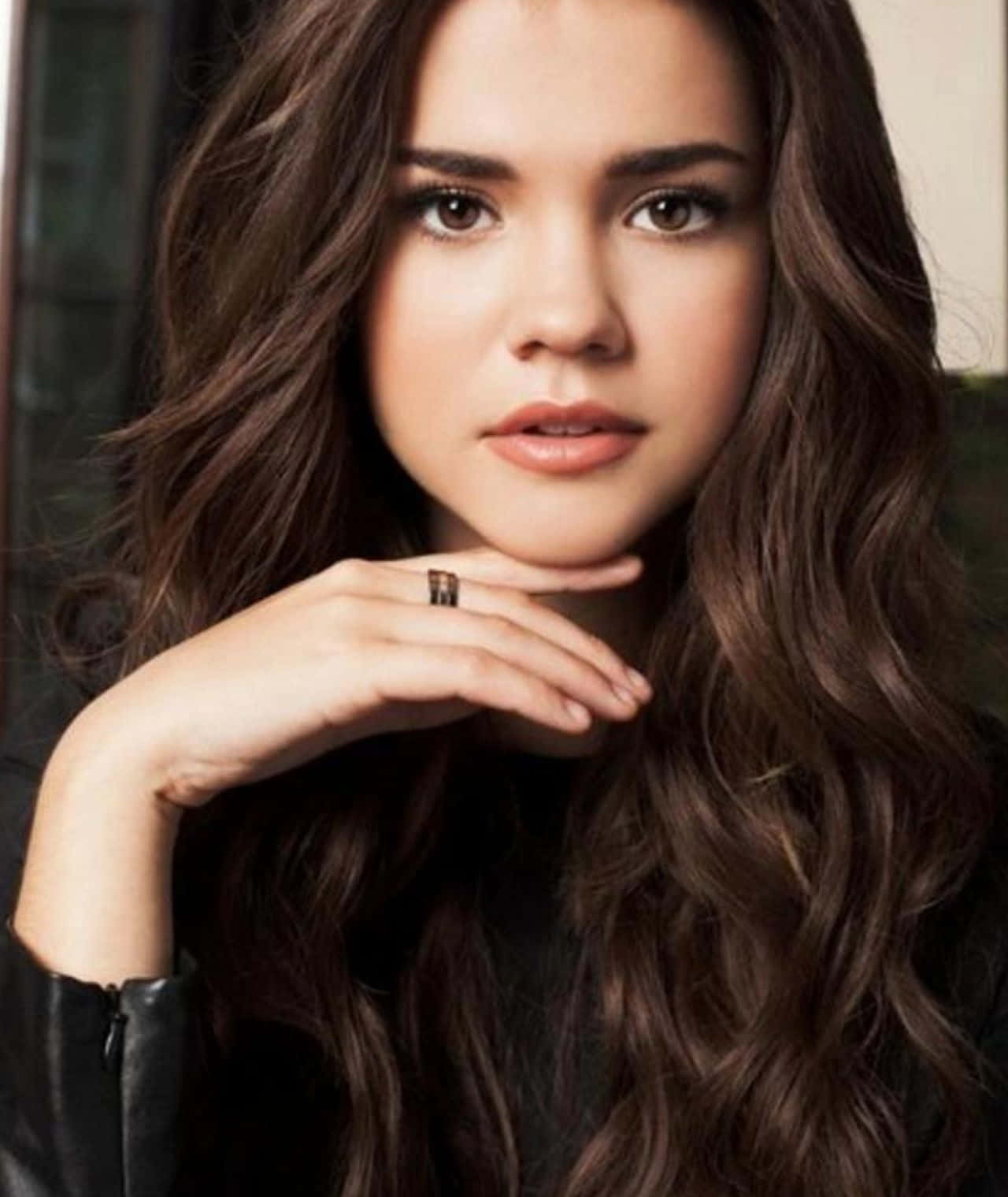 Maia Mitchell In Elegant Casual Attire Background