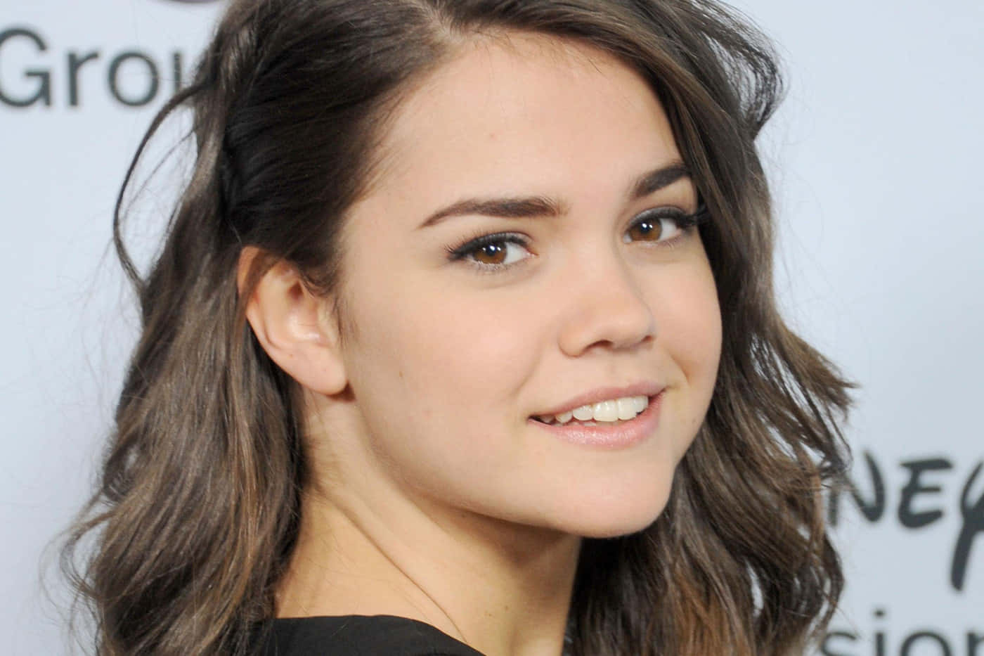 Maia Mitchell Smiling Closeup Background