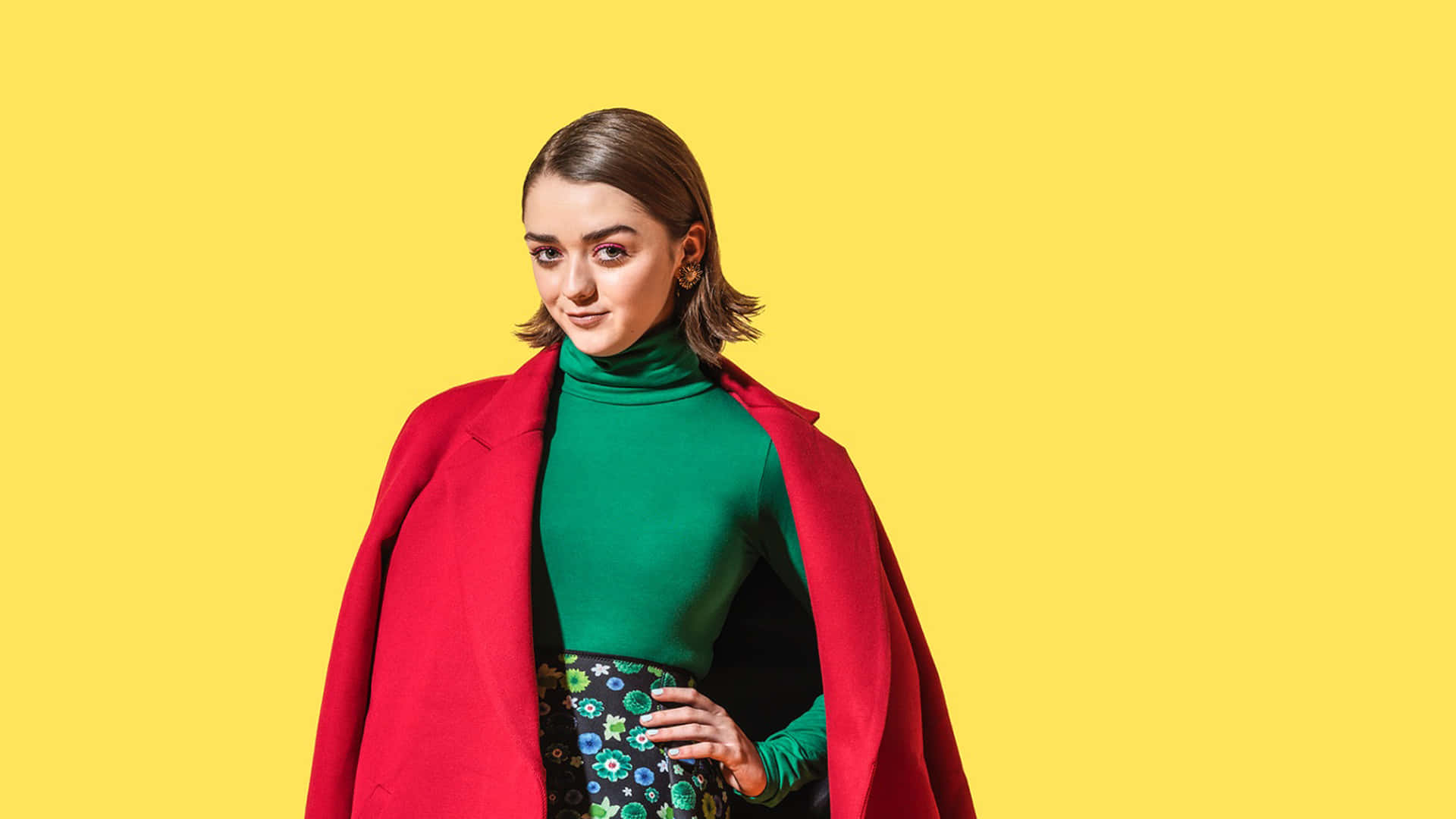 Maisie Williams Posing At A Media Event Background