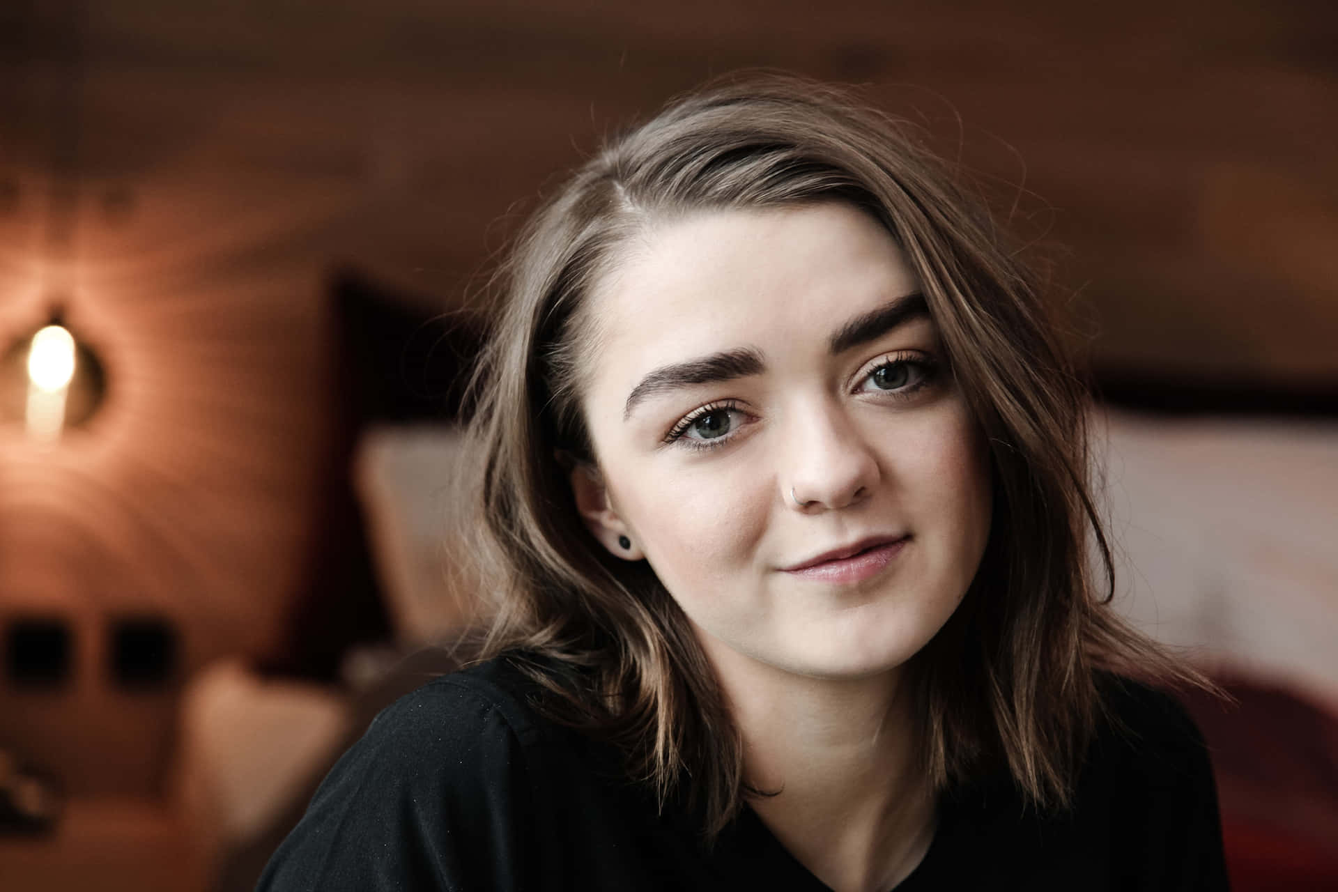 Maisie Williams Posing Elegantly In A Green Dress Background