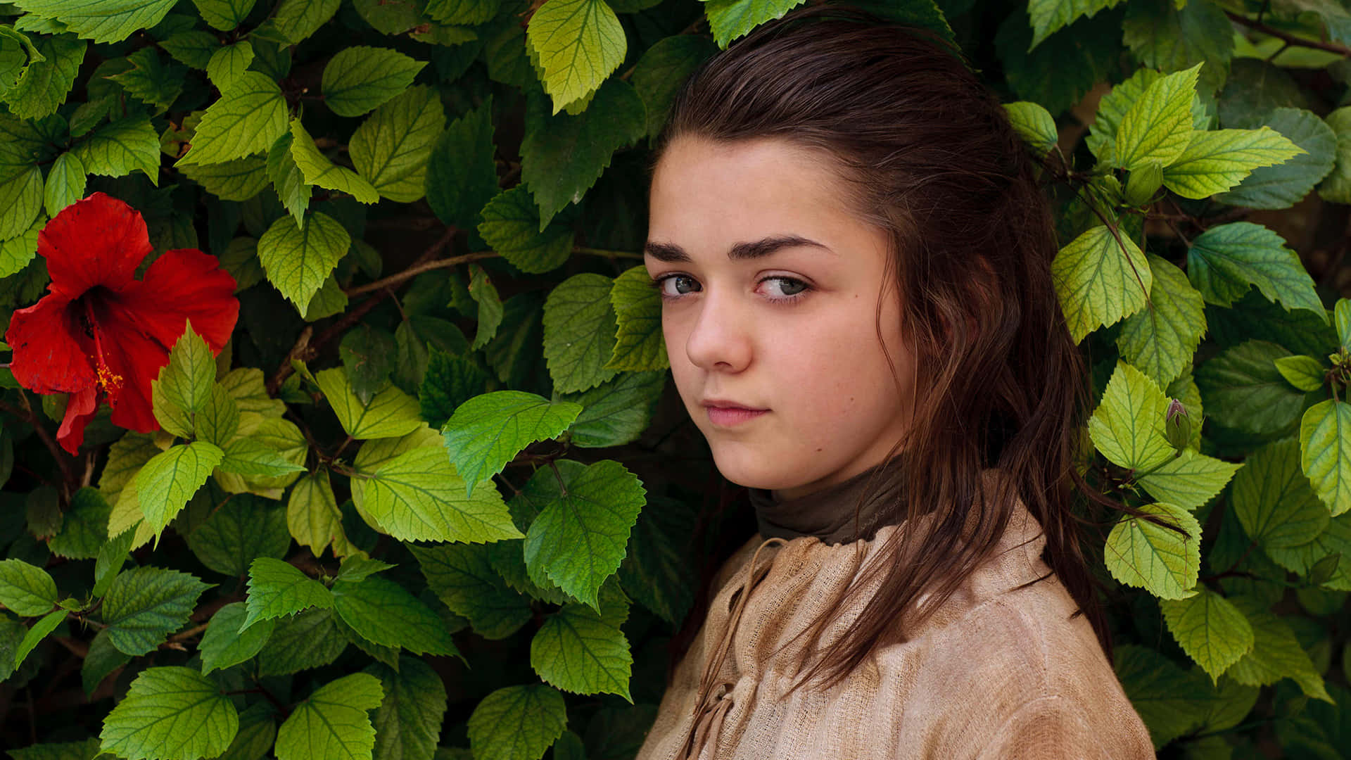 Maisie Williams Smiling At The Red Carpet Event Background