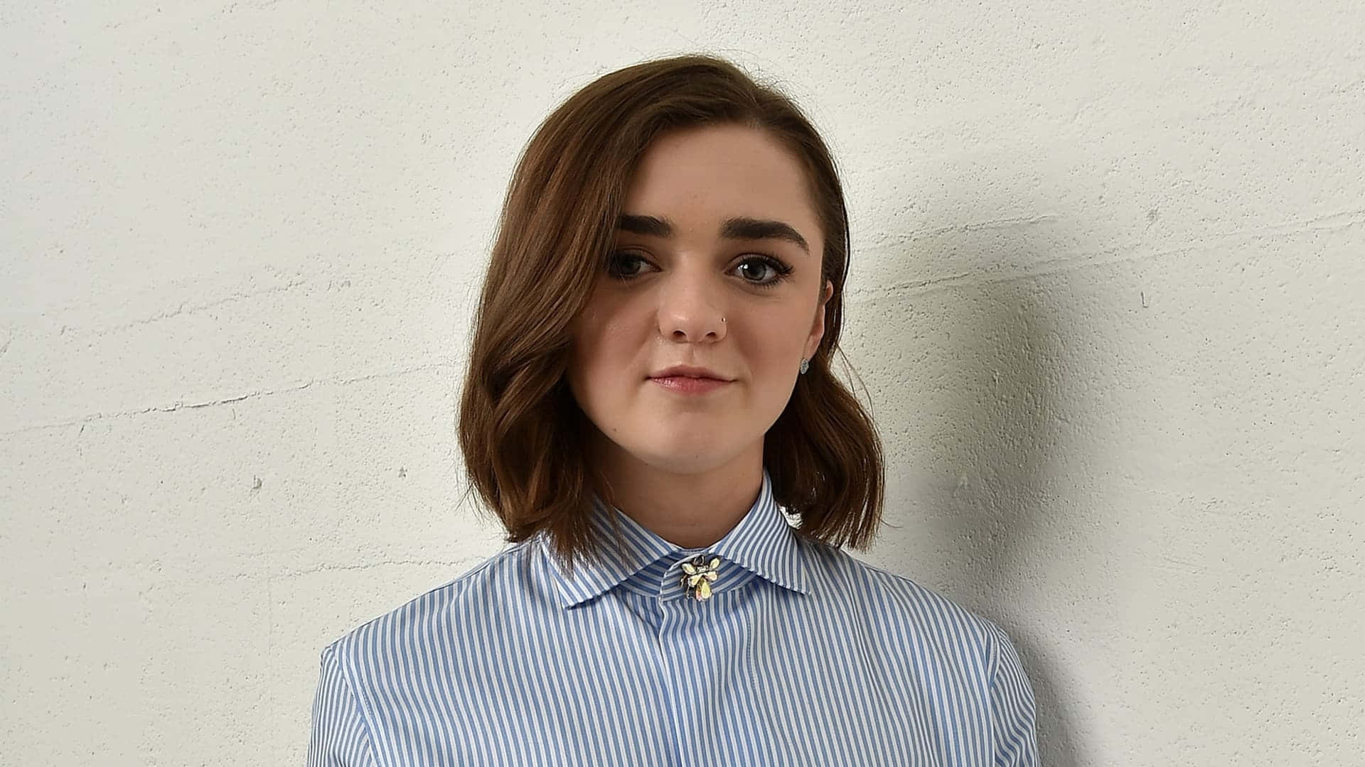 Maisie Williams Striking A Pose Background