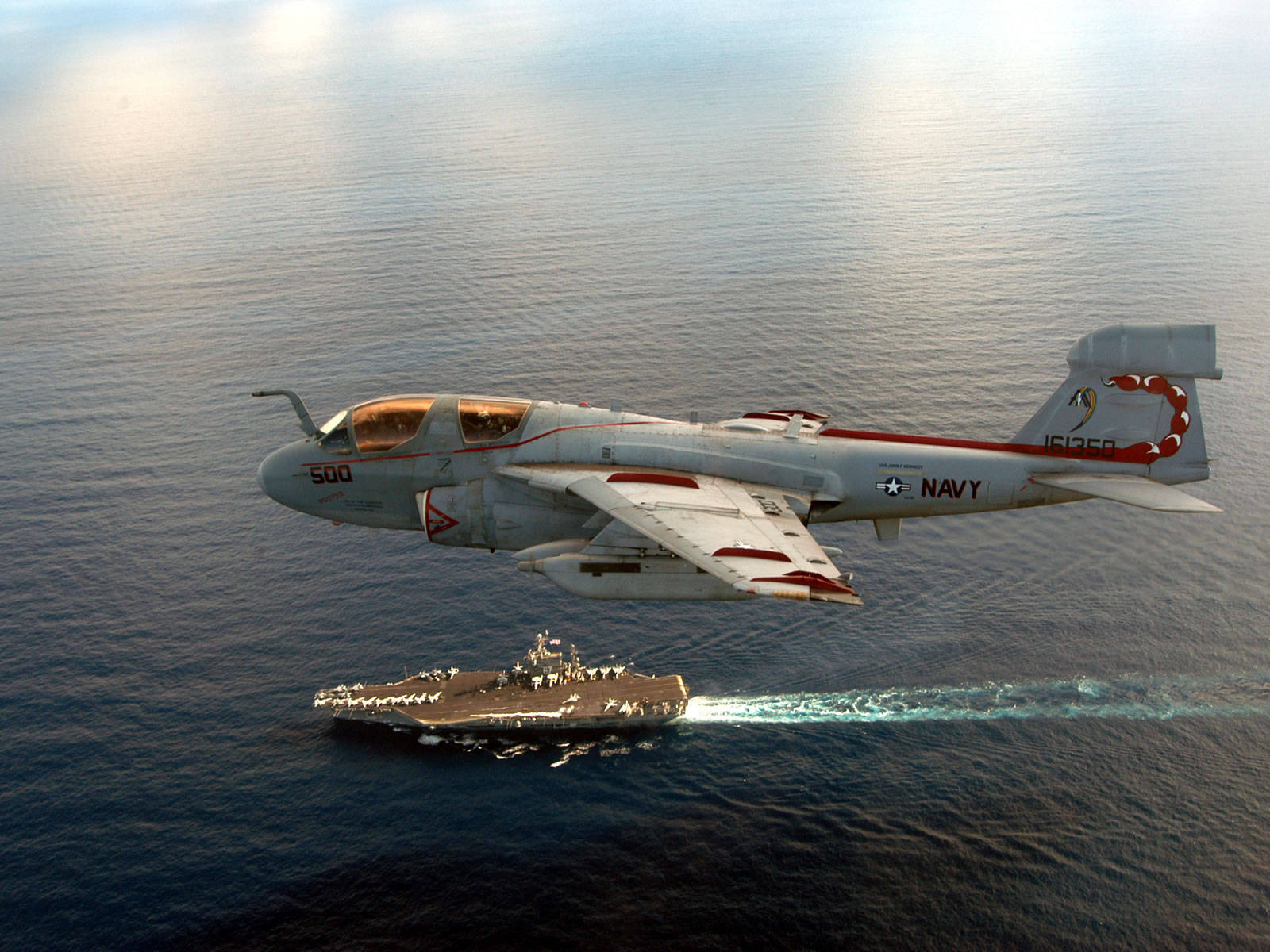 Majestic A-6 Intruder Fighter Jet Soaring In The Sky Background