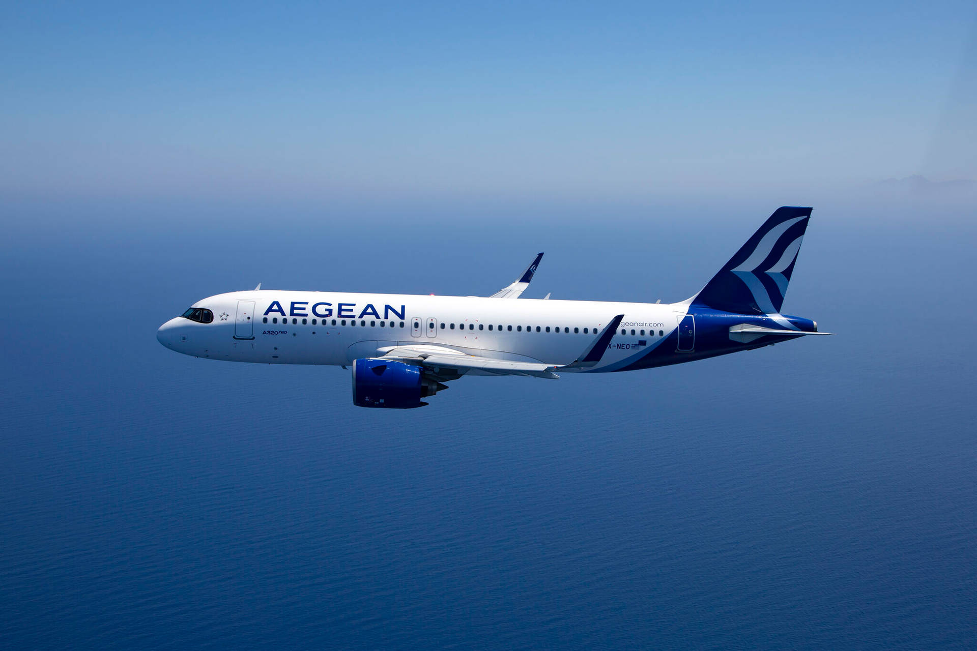 Majestic Aegean Airlines A320neo Jet Takes Flight Against Azure Sky