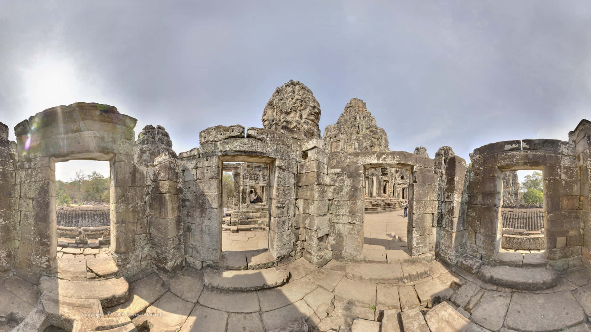 Majestic Angkor Thom Shrouded Beneath A Mysterious Gray Sky Background