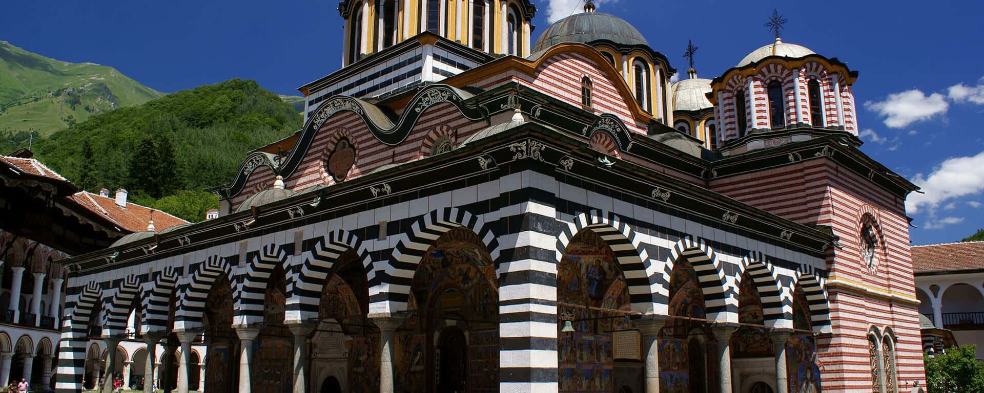 Majestic Arches Of Rila Monastery Background