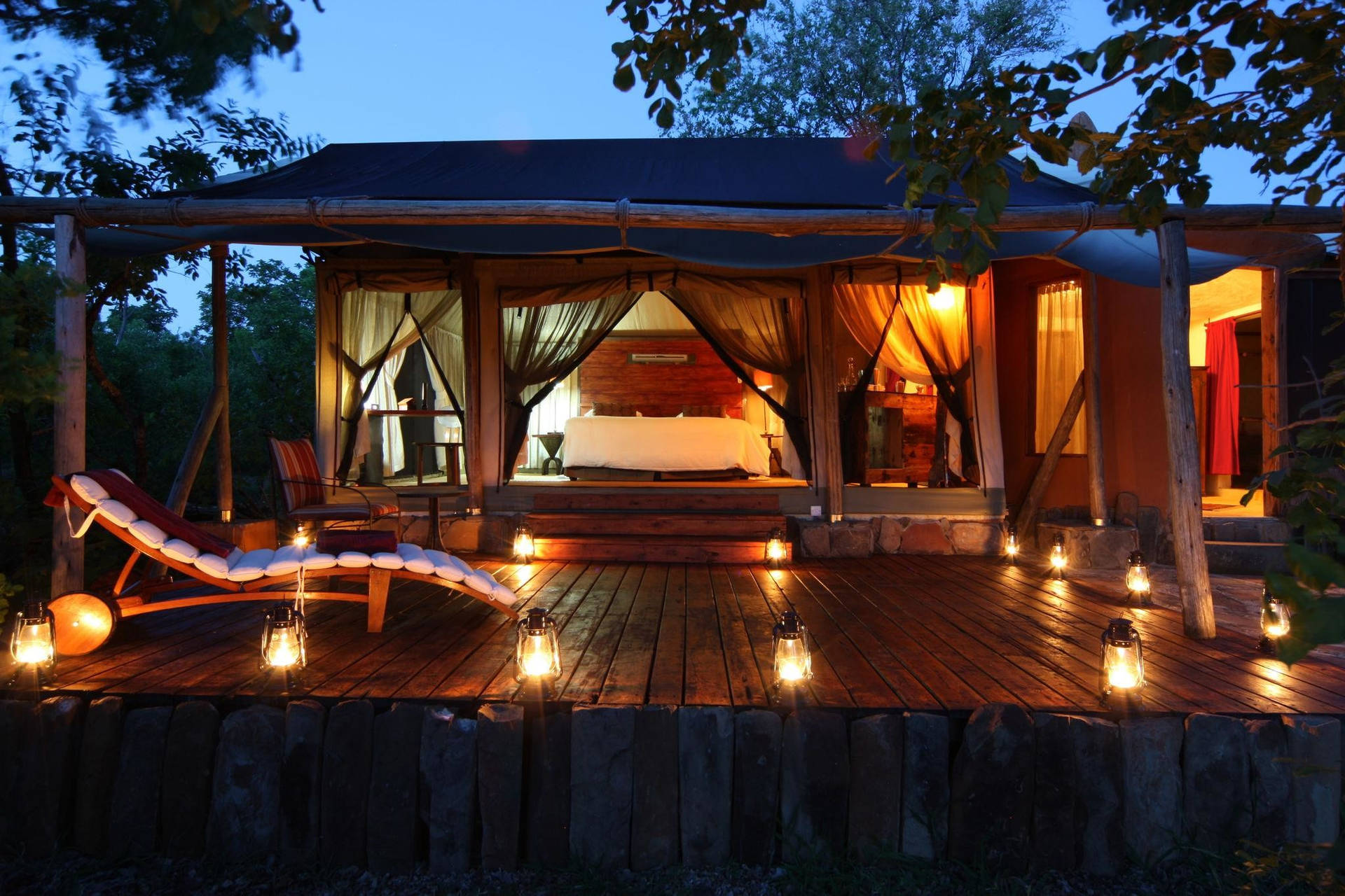 Majestic Azura Selous Lodge Under Starlit Tanzanian Sky Background