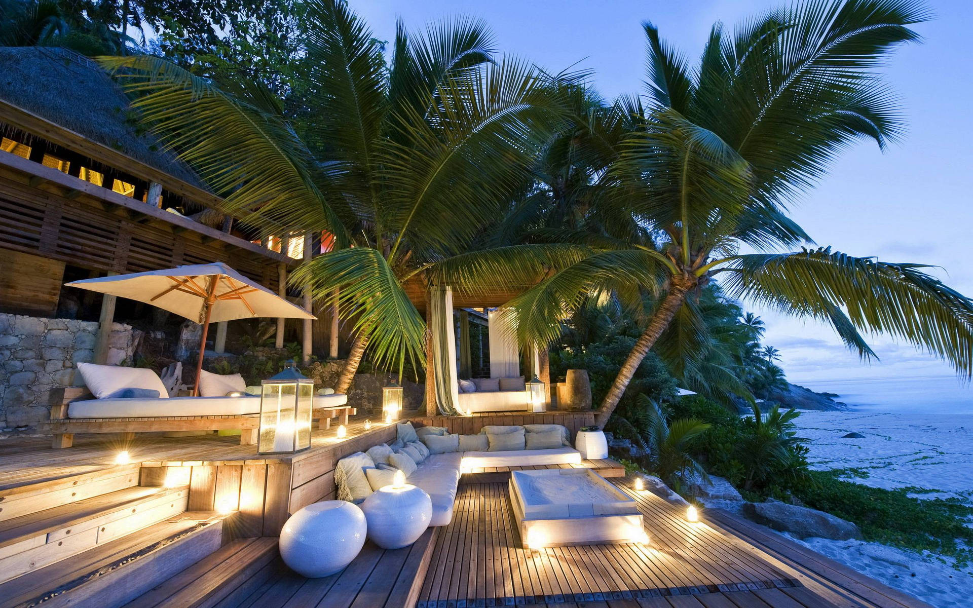 Majestic Beach House Overlooking The Crystal Clear Waters Of Seychelles Background