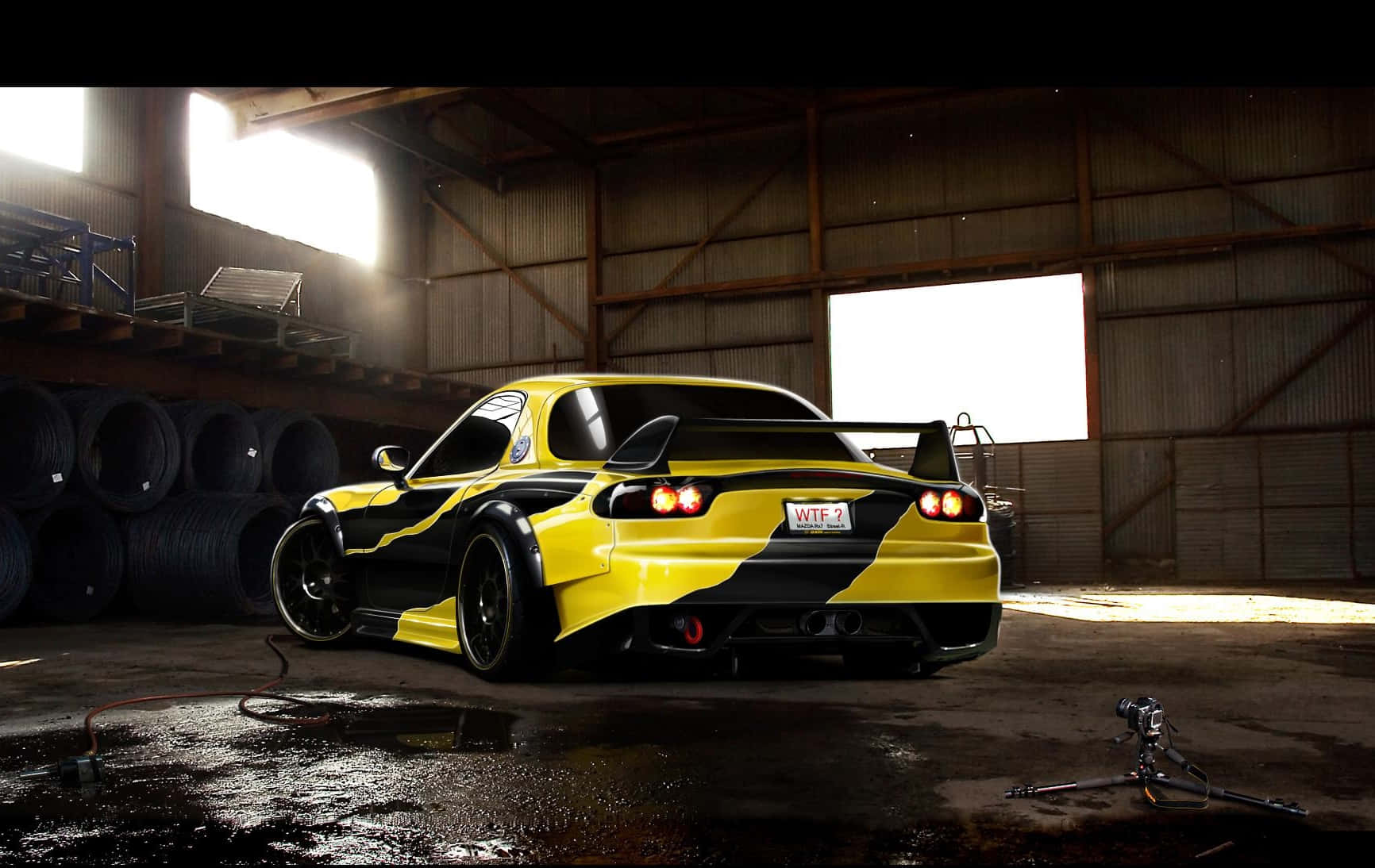 Majestic Black And Yellow Mazda Rx 7 In High Definition Background