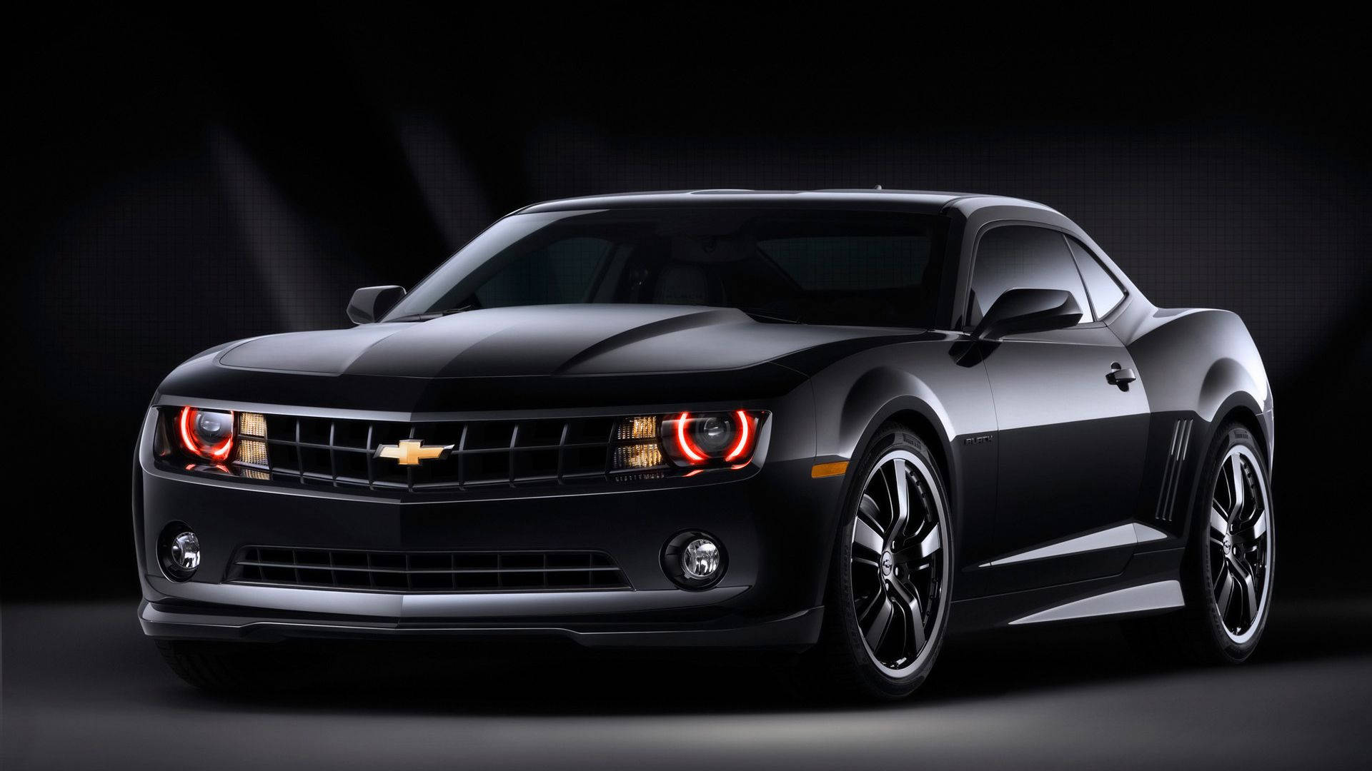 Majestic Black Chevrolet Camaro Muscle Car Background