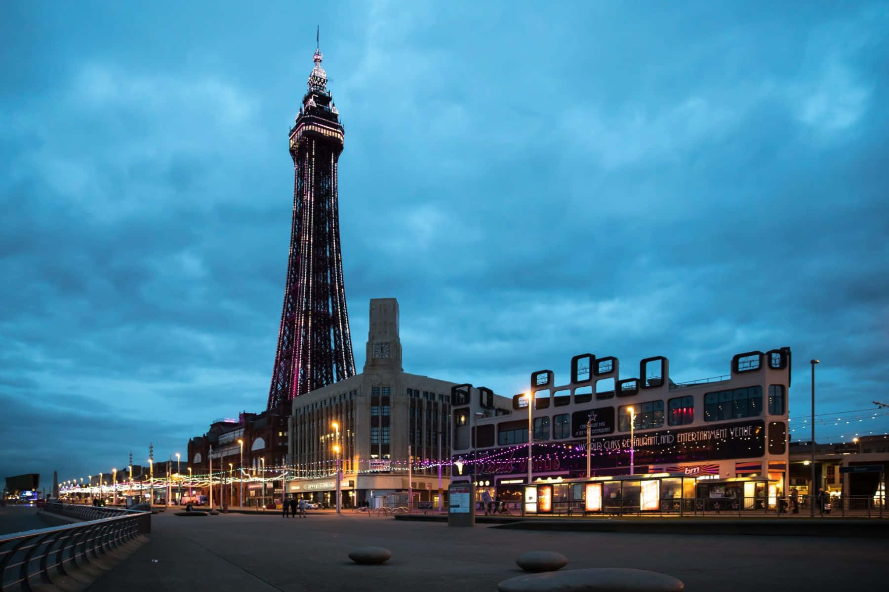Majestic Blackpool Tower Against A Cloudy Blue Sky Background