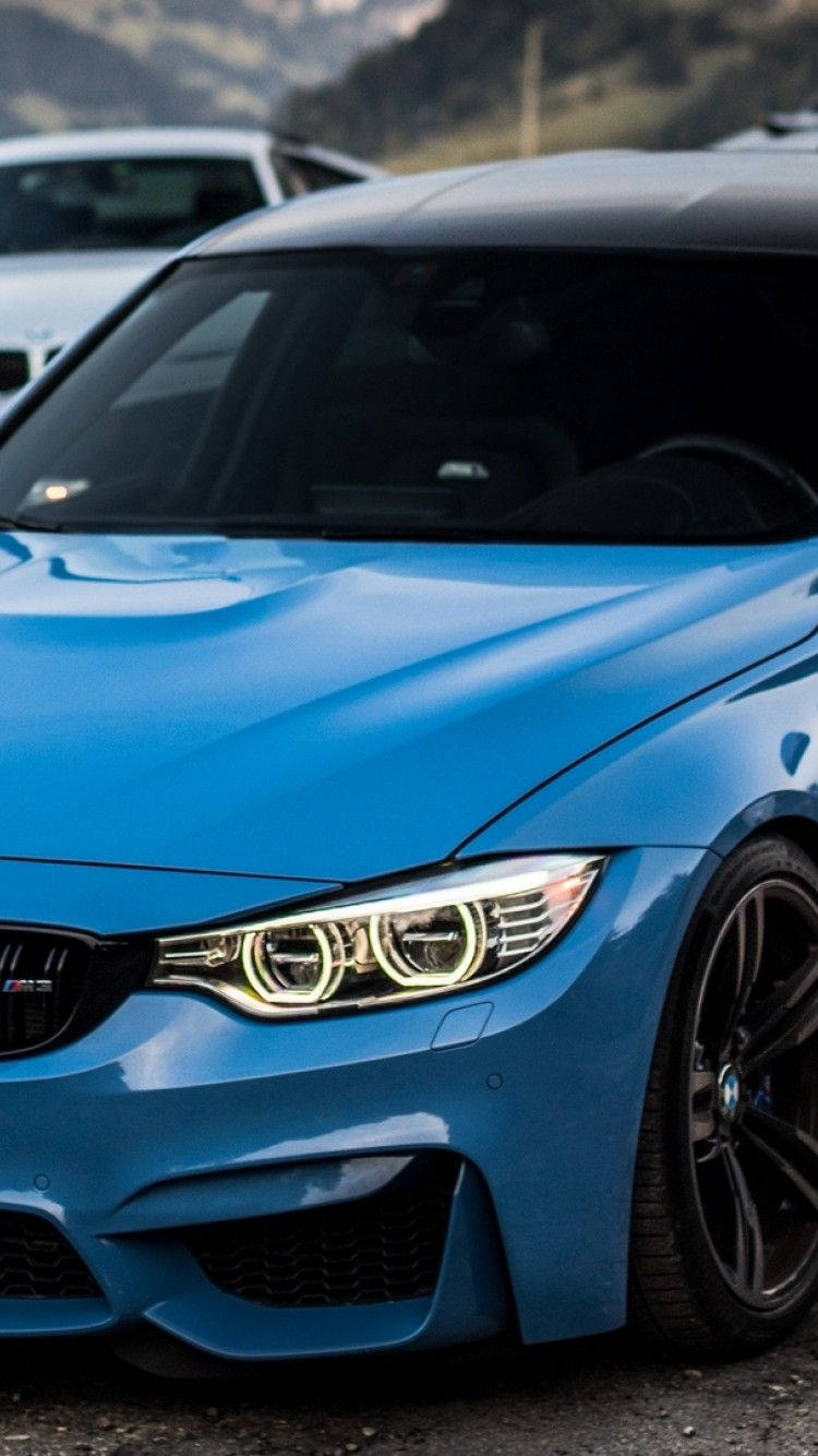 Majestic Blue Bmw In Close-up View Background