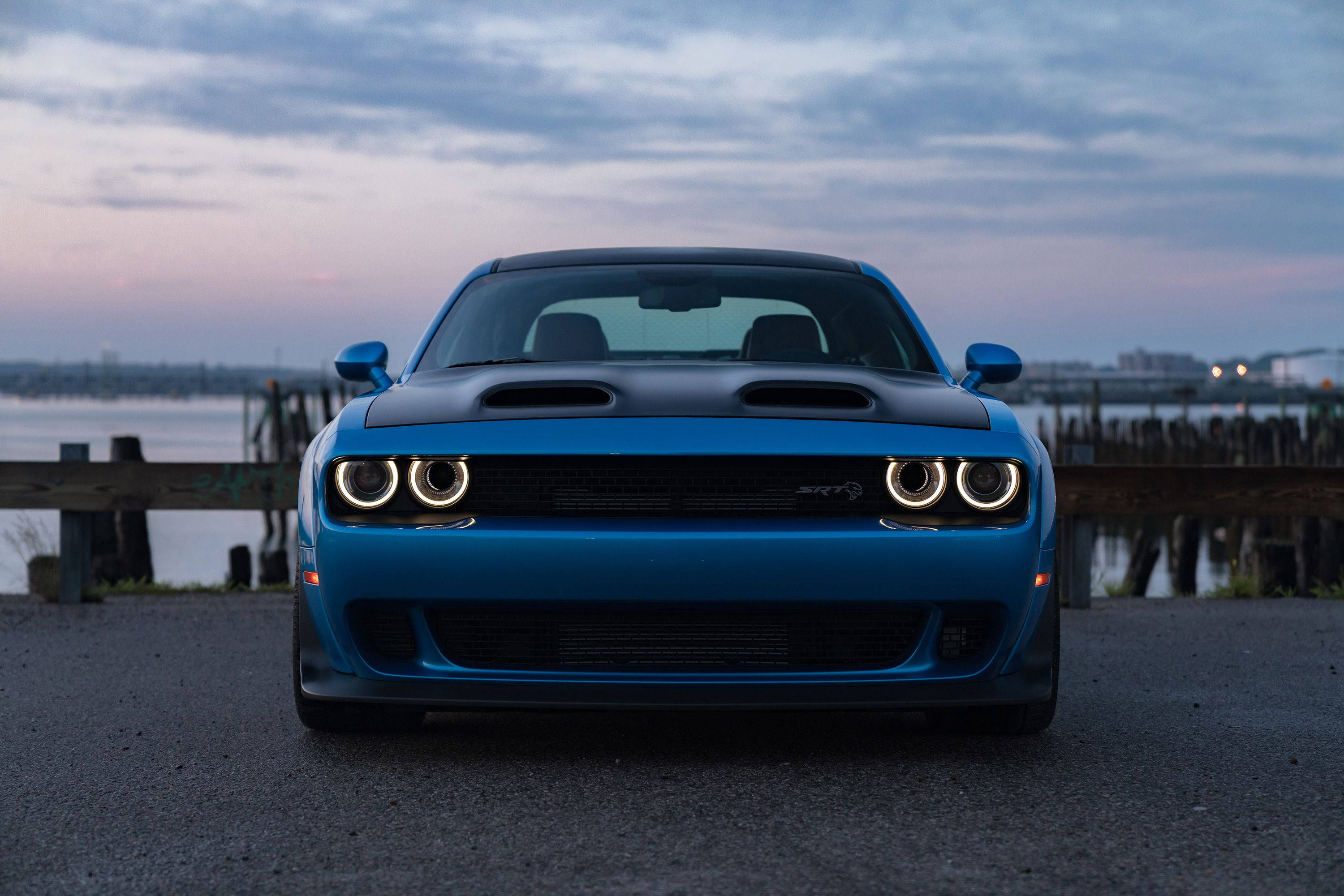 Majestic Blue Dodge Challenger Overlooking The Bay Background