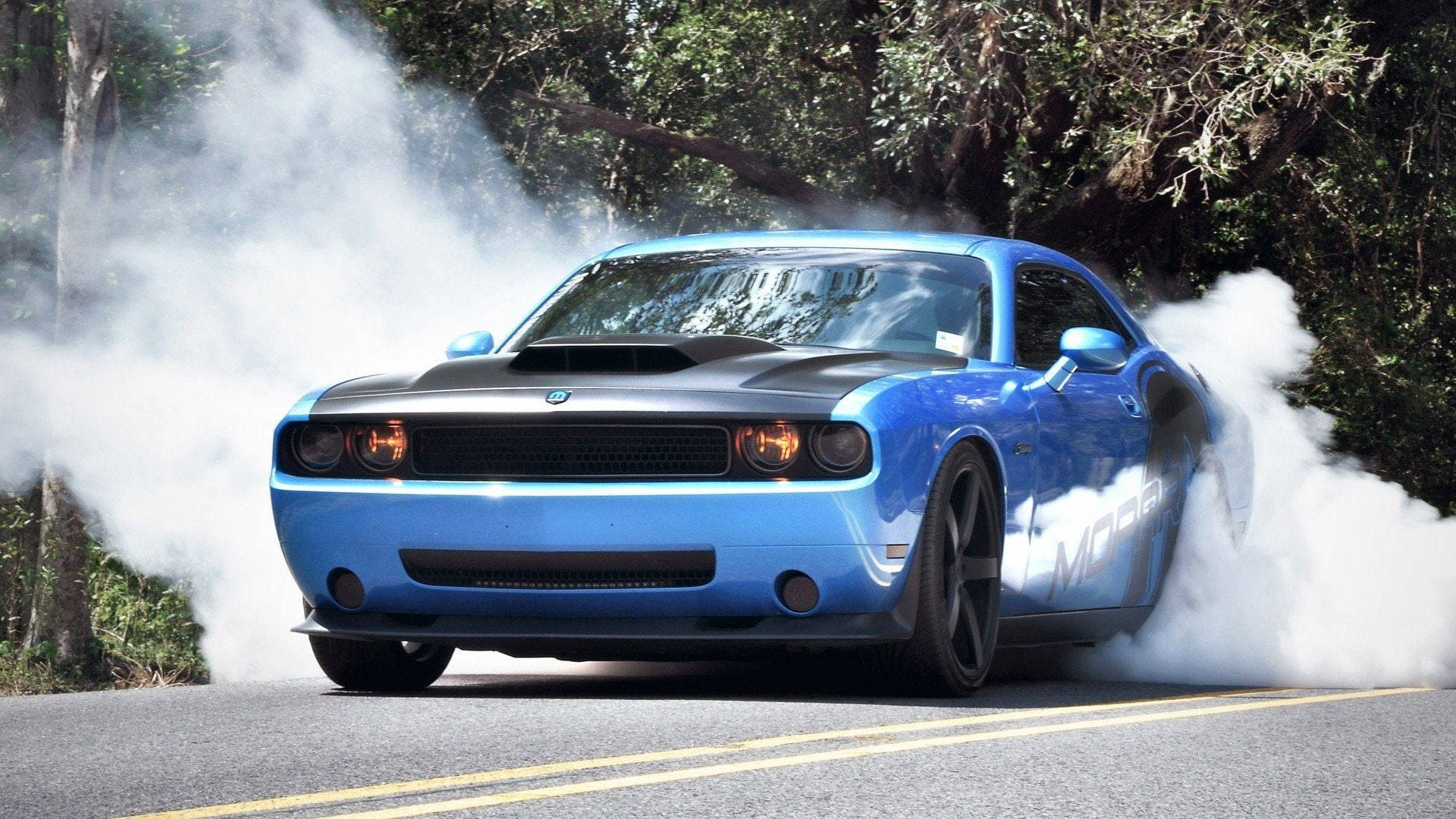 Majestic Blue Dodge Challenger Unleashing Power Background