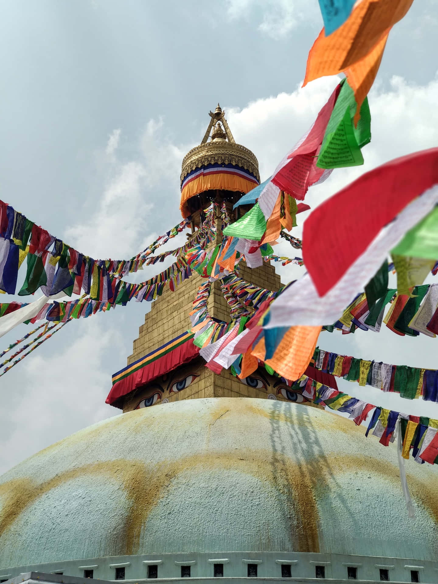 Majestic Boudhanath Stupa Adorned With Colorful Prayer Flags Background