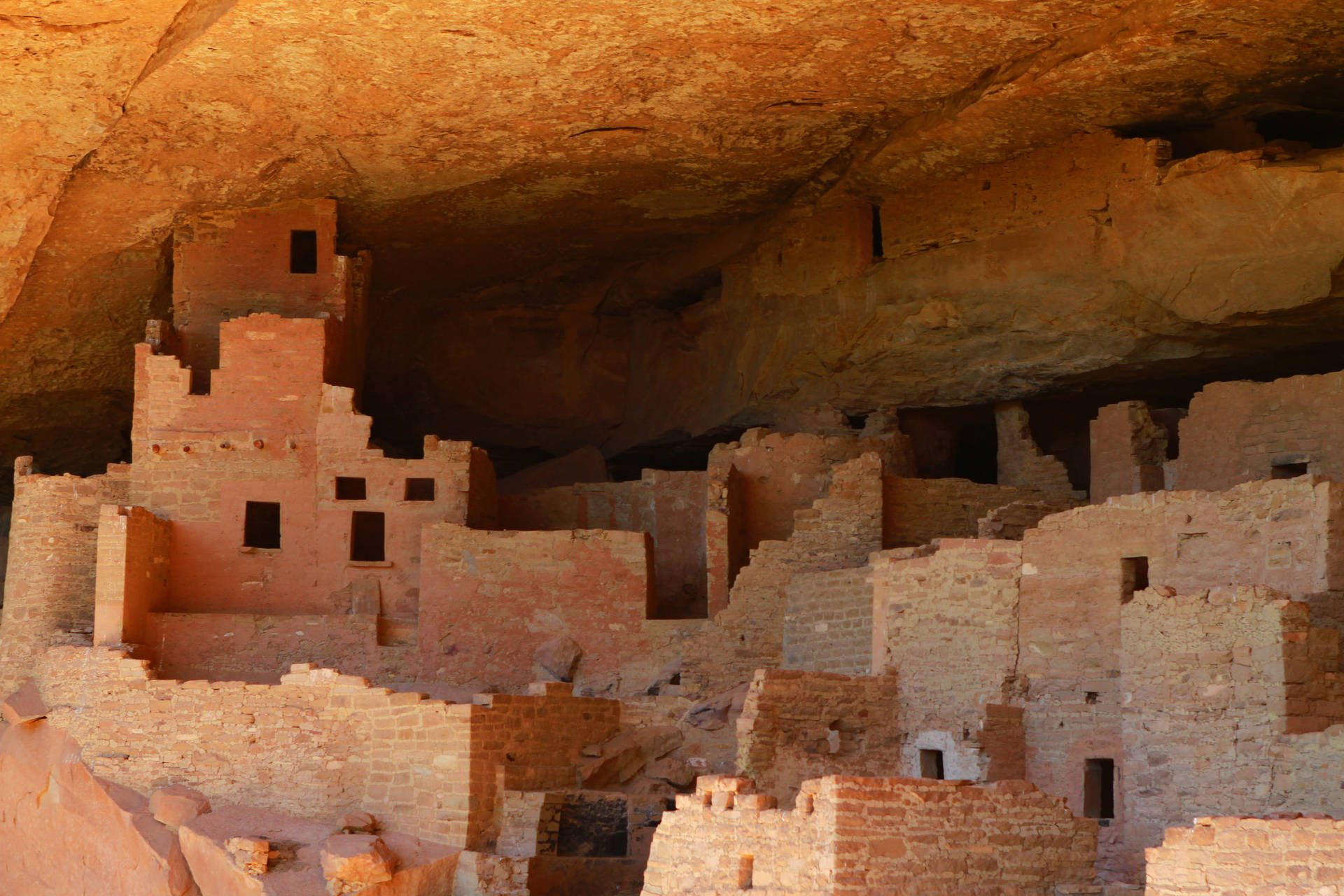 Majestic Brick Formations In Mesa Verde Background