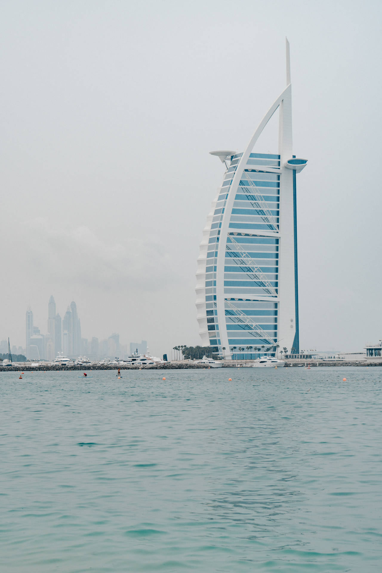 Majestic Burj Al Arab Against A Refreshing Pastel Blue Sky