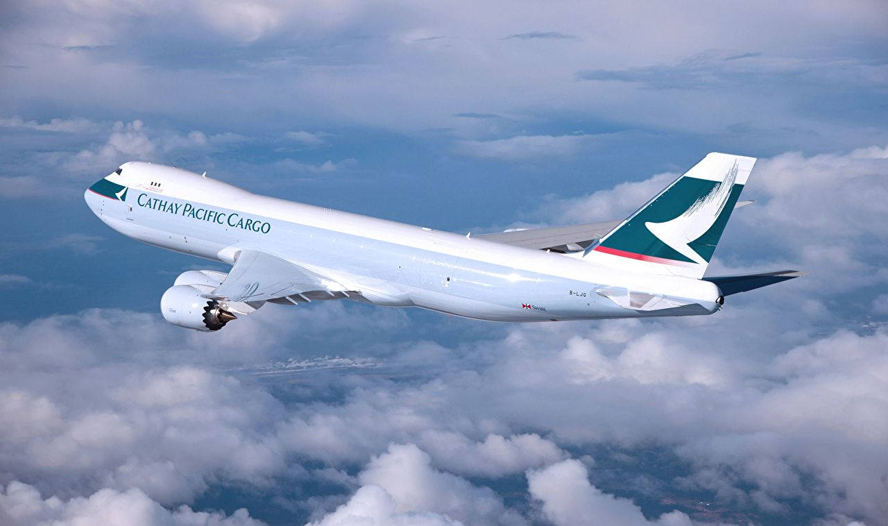 Majestic Cathay Pacific Cargo Airplane In Flight Background