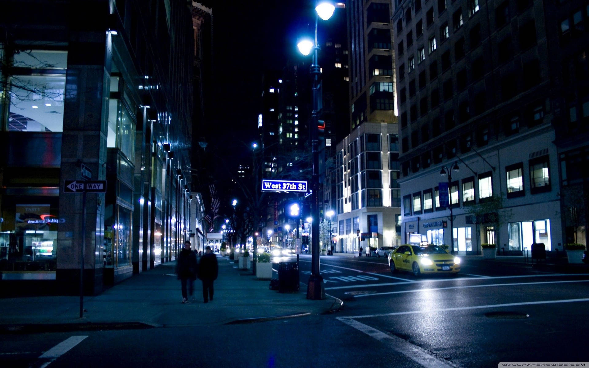 Majestic City Lights Illuminate The Night Background