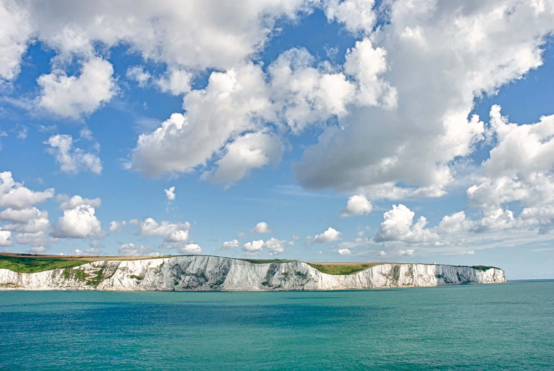Majestic Clouds Over The White Cliffs Of Dover Background
