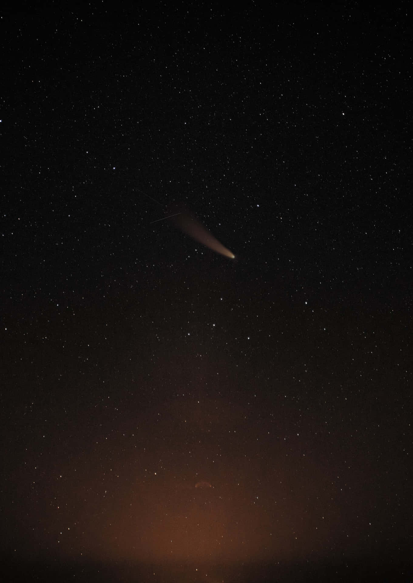 Majestic Comet Traversing The Night Sky Background