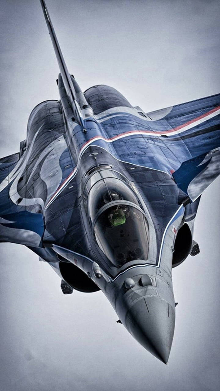 Majestic Dark Blue Fighter Jet In Flight Background