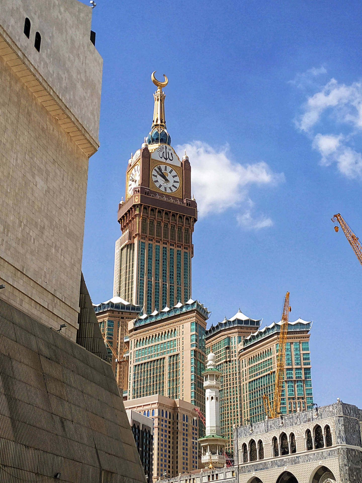 Majestic Daytime View Of Makkah Madina Royal Clock Tower Background