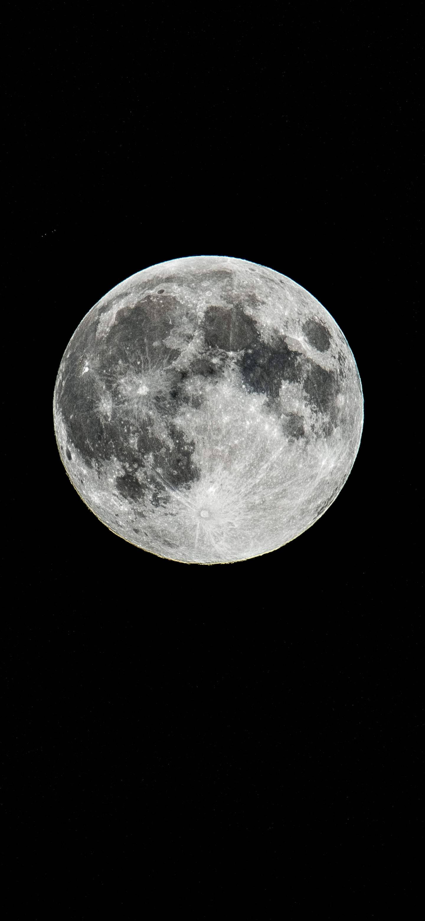 Majestic Display Of Oneplus 7 Pro Against The Backdrop Of The Moon Background