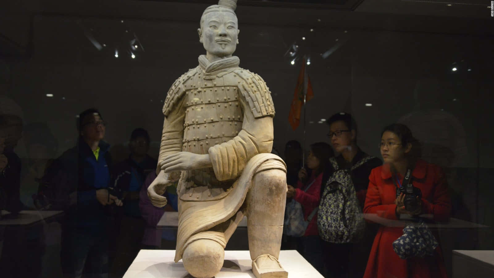 Majestic Display Of Terracotta Warriors In Museum Background