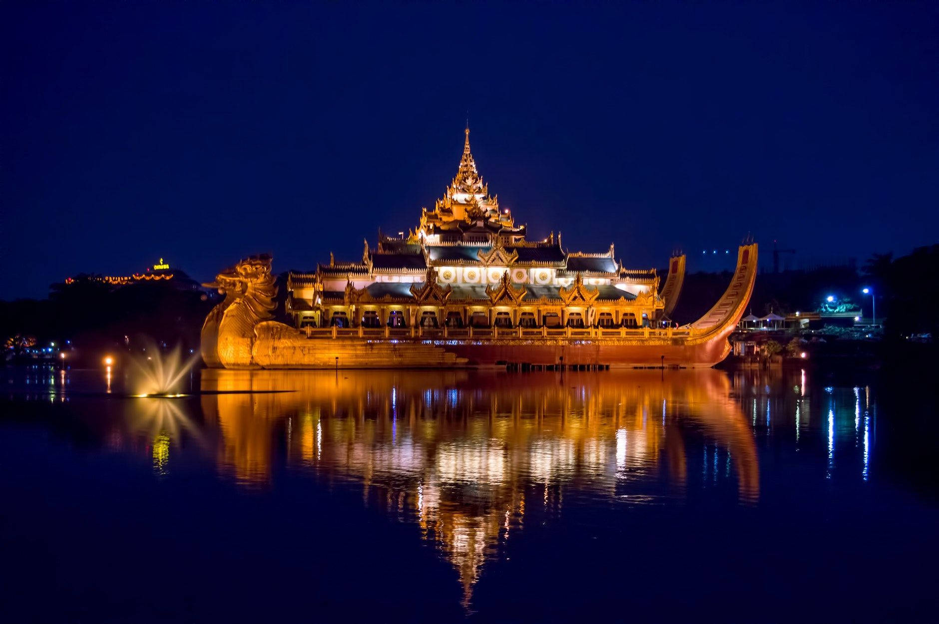Majestic Dragon-shaped Karaweik Palace In Yangon Background