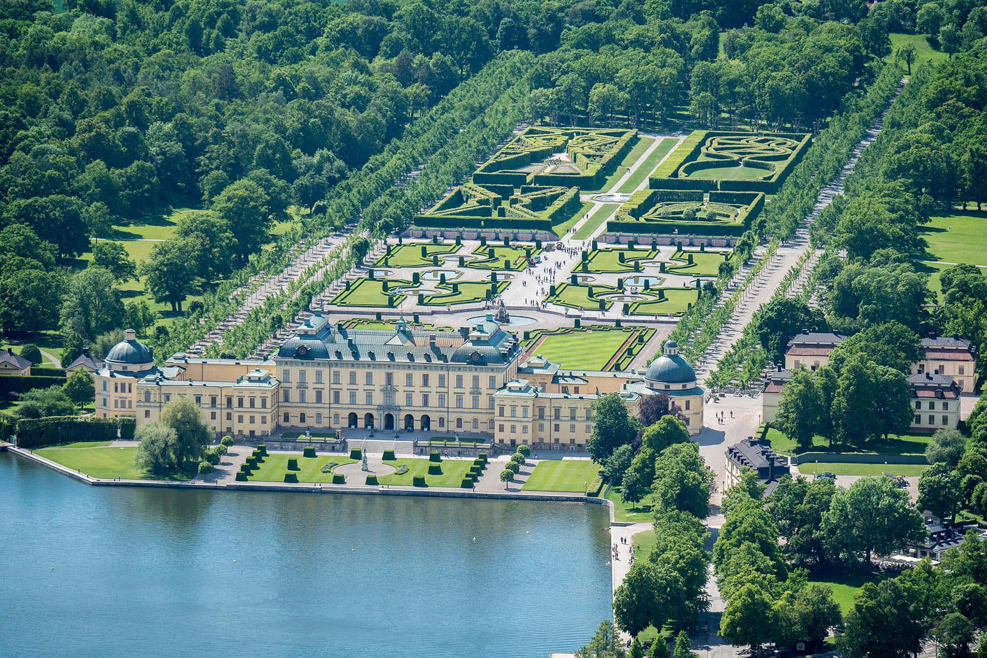 Majestic Drottningholm Palace Under A Clear Blue Sky. Background