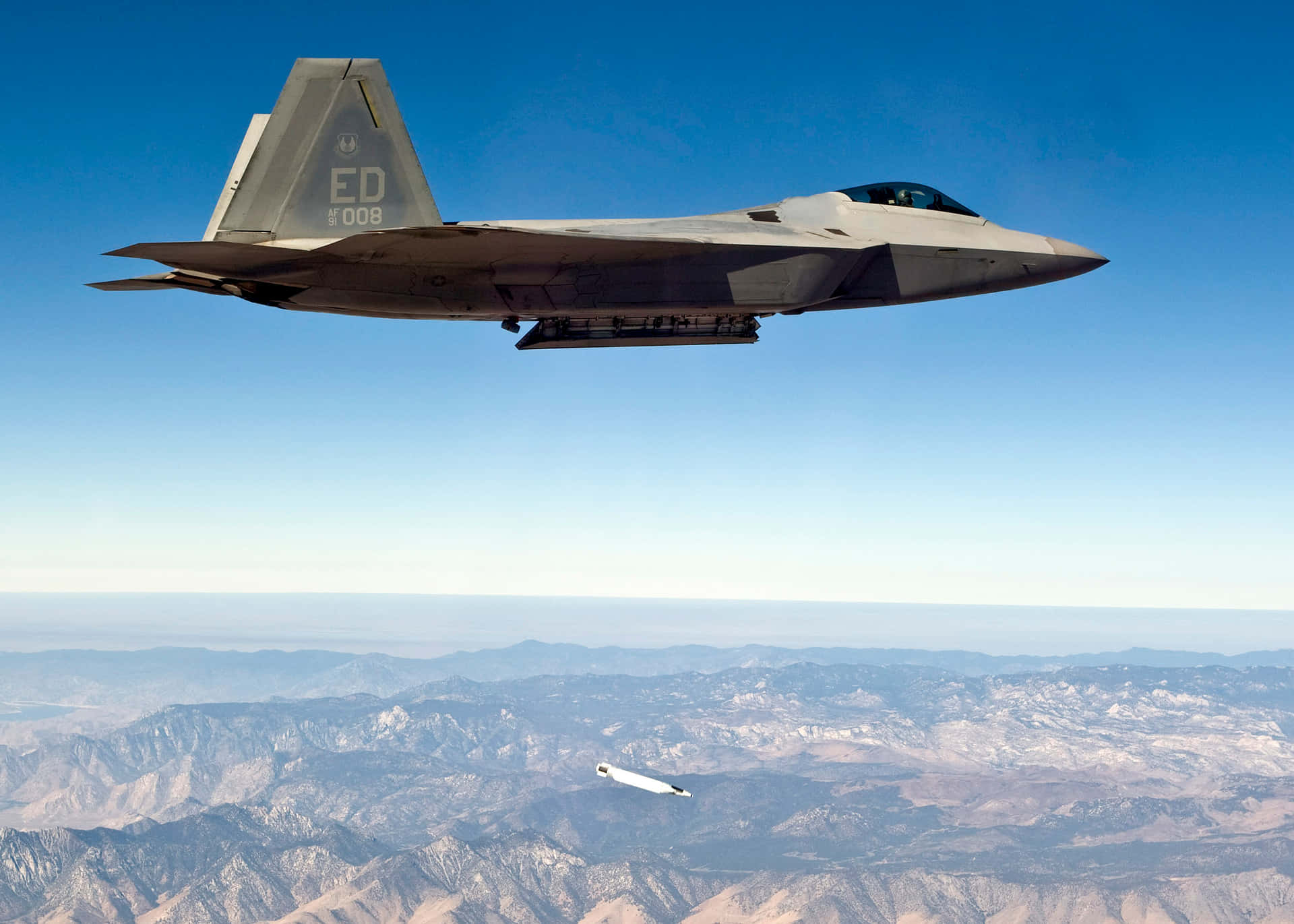 Majestic F-22 Raptor Soars Over The United States Background