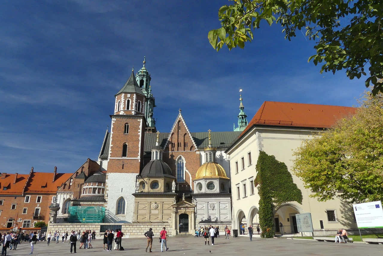 Majestic Facade Of Wawel Castle In Krakow, Poland Background