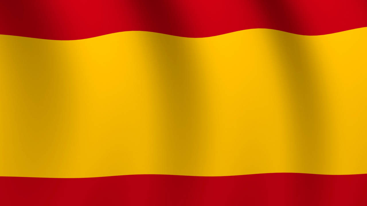 Majestic Flag Of Spain Fluttering In The Wind Background