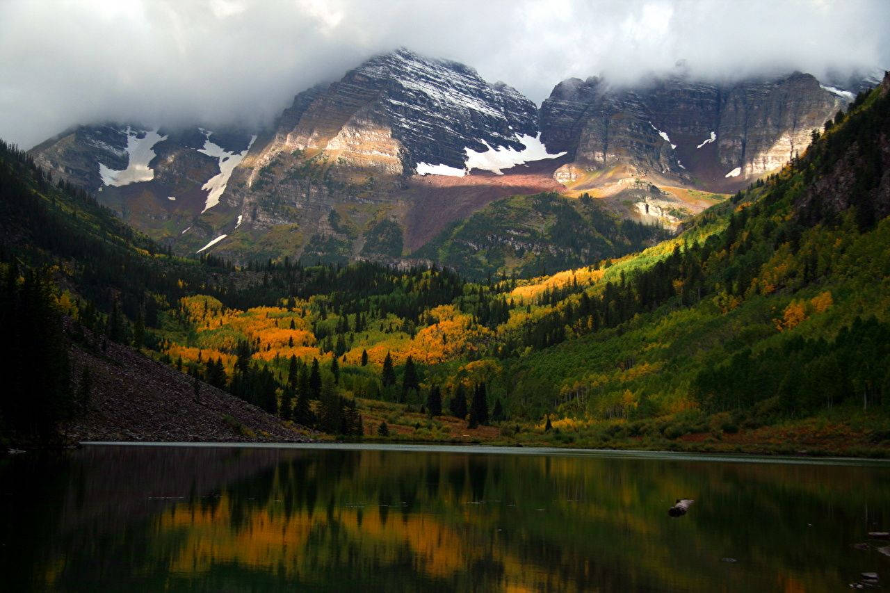 Majestic Fog-covered Peaks At Rocky Mountain National Park