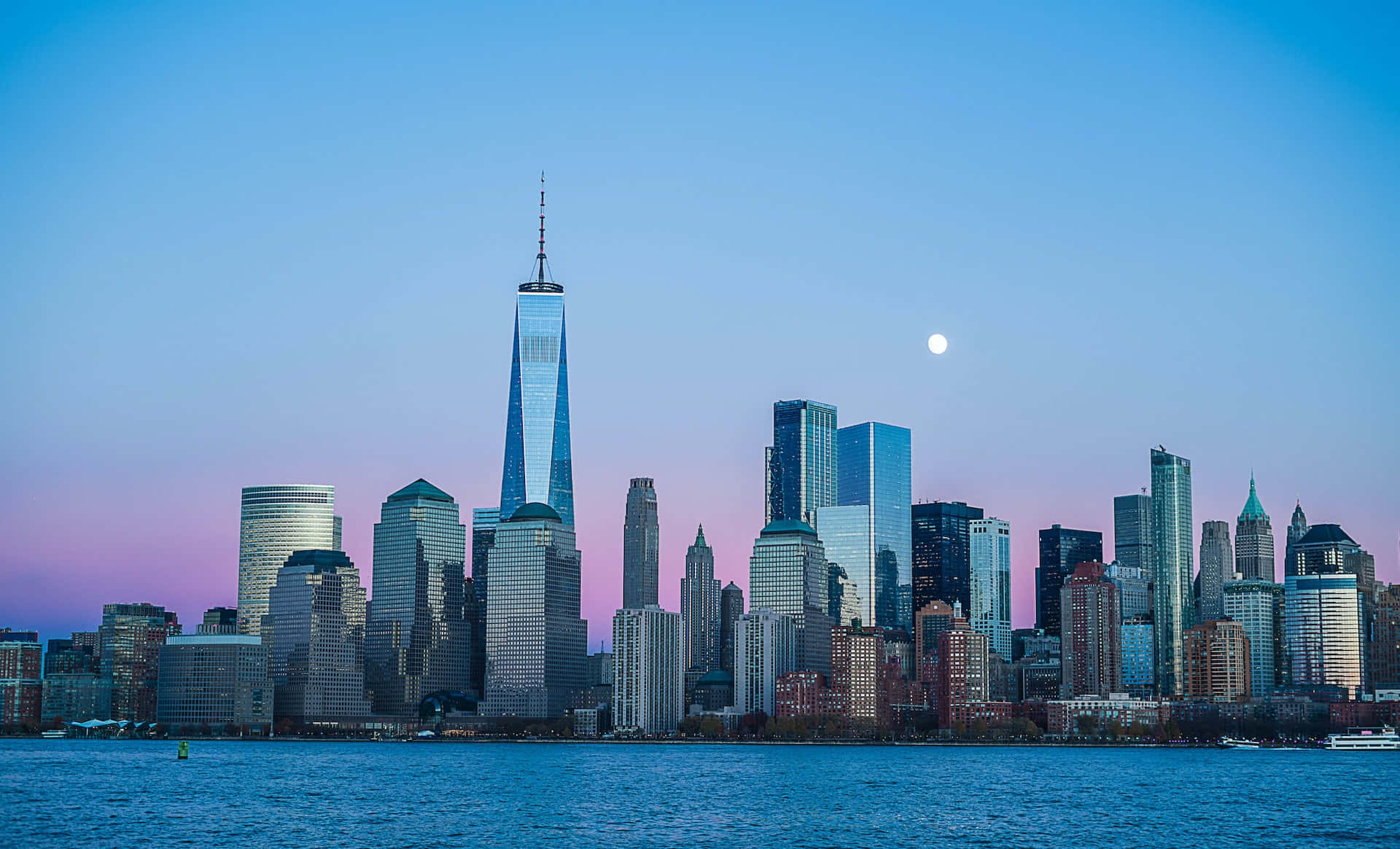 Majestic Freedom Tower Dominates The New York Skyline At Dusk Background