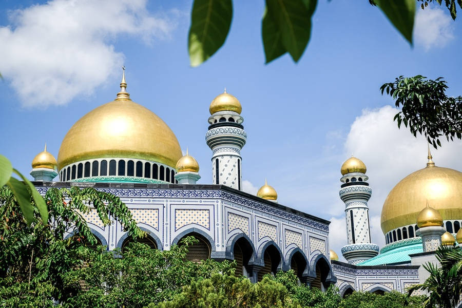 Majestic Gold Domes Of The Brunei Mosque Background