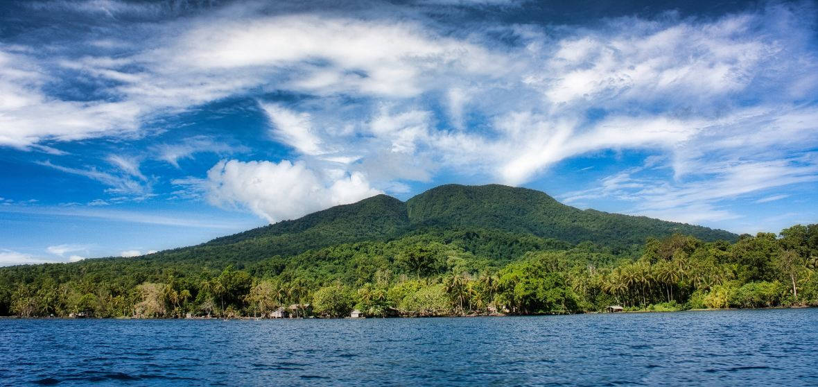 Majestic Green Mountain Of The Solomon Islands Background