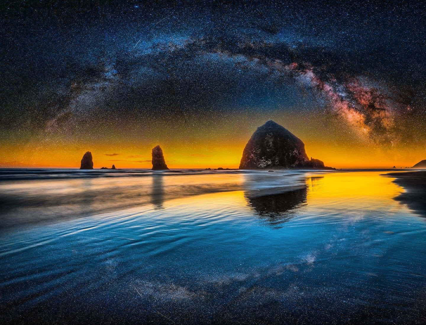 Majestic Haystack Rock On Oregon Beach Background